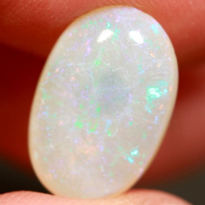 SOLID CRYSTAL OPAL Pinfires of pinks and greens throughout
